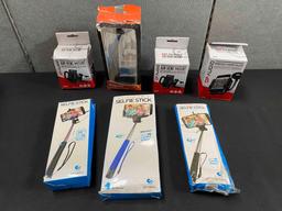 Lot of Smartphone Holders and Extendable Selfie Sticks