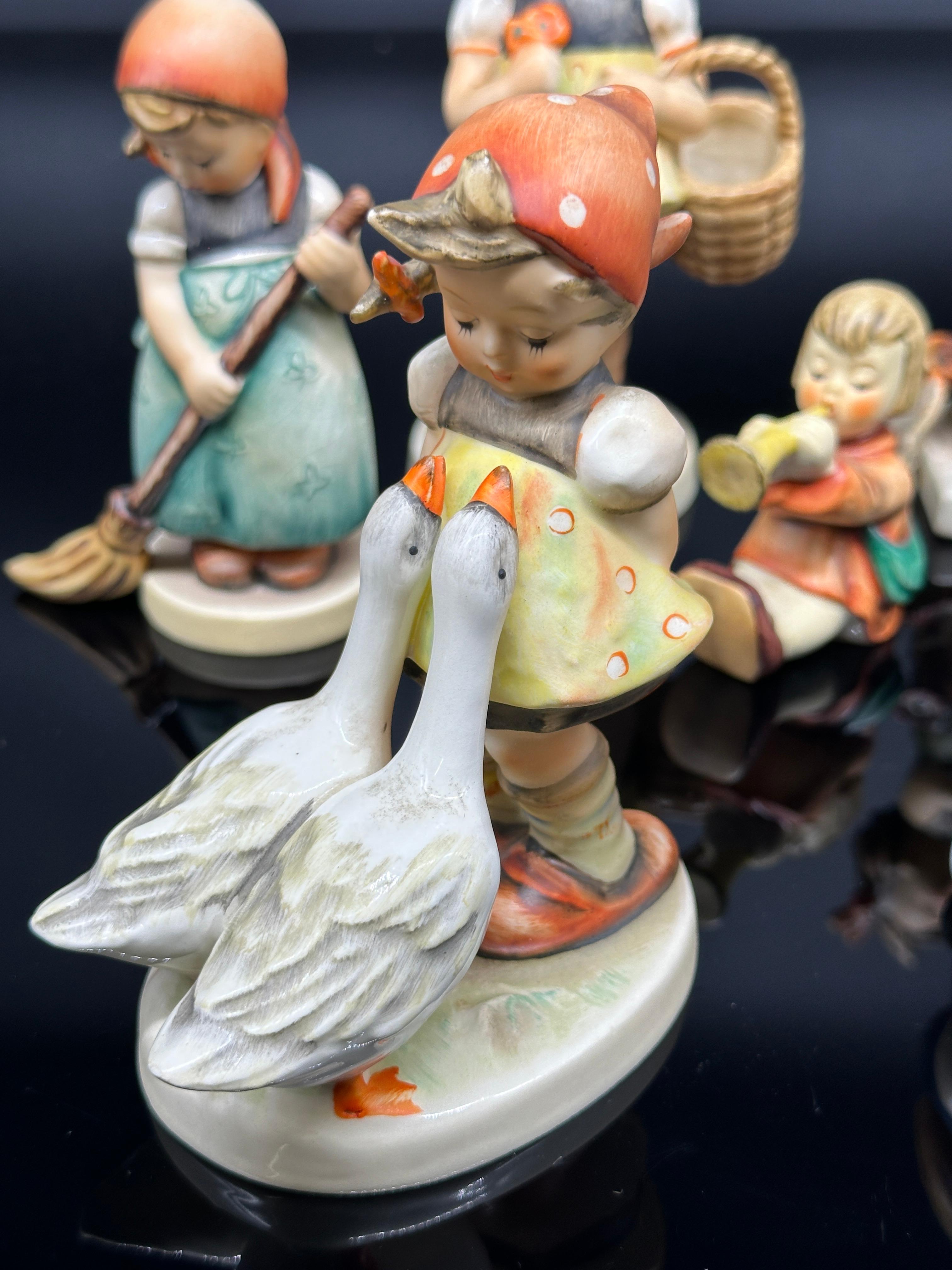 Eight Goebel Hummell Figurines