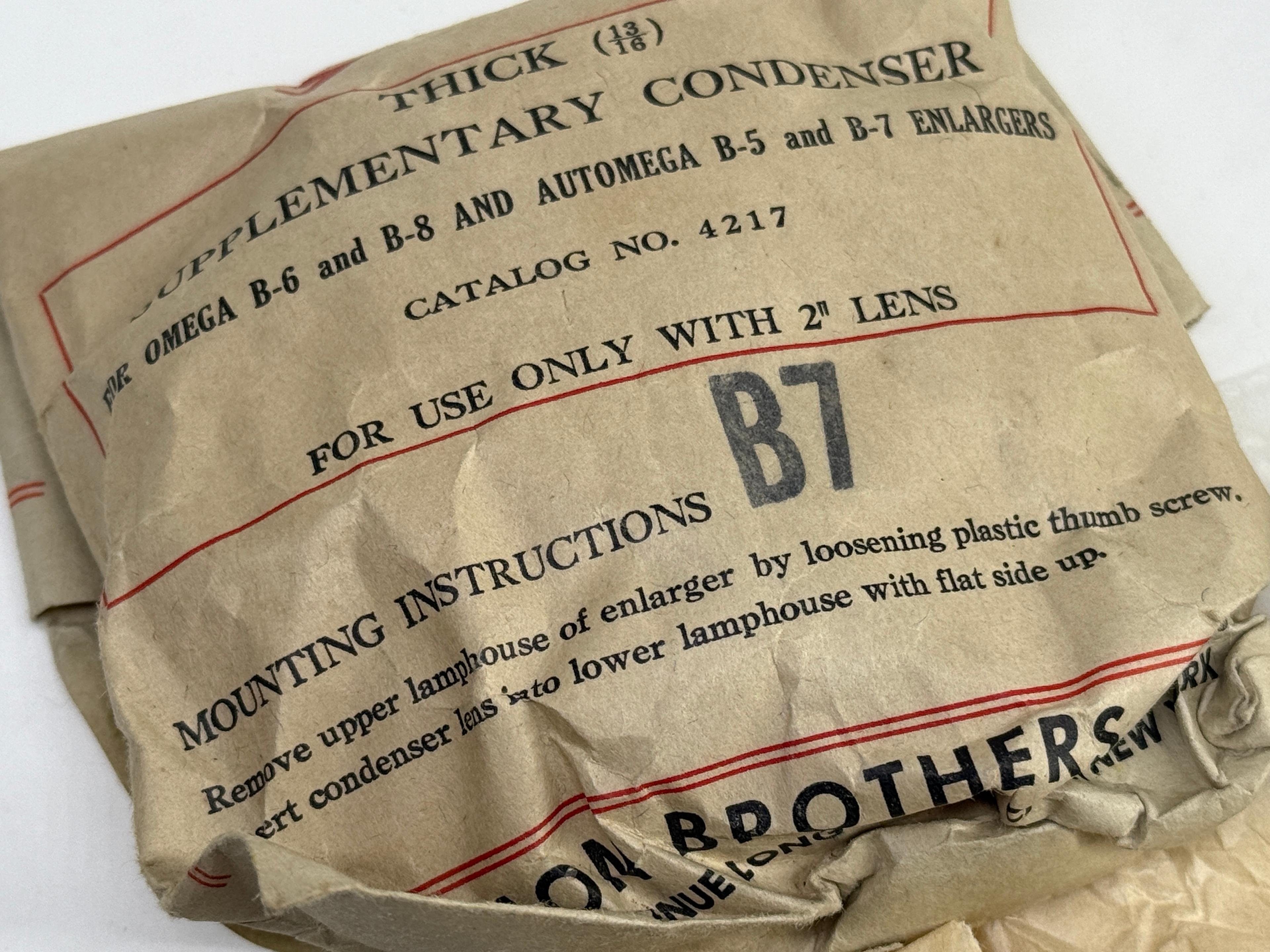 Assortment of Vintage Omega & Simmon Enlarger Condenser Lenses in Original Packaging