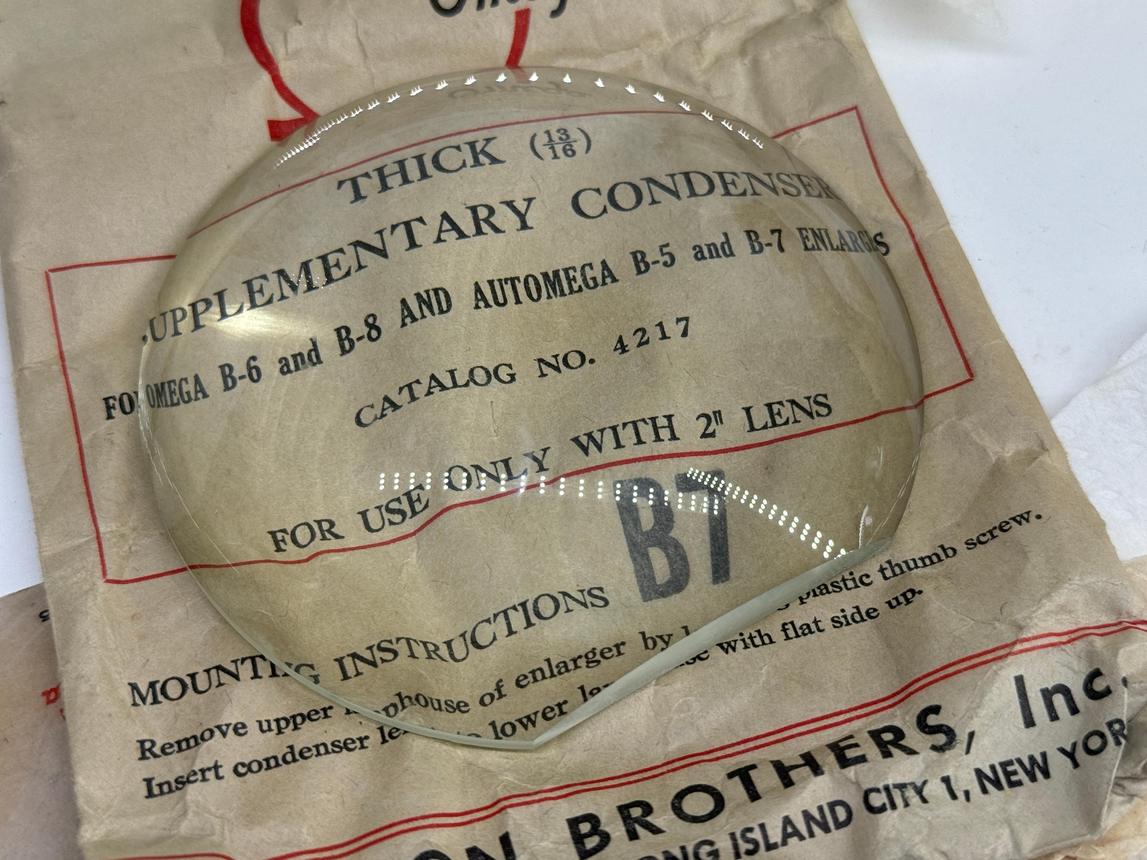 Assortment of Vintage Omega & Simmon Enlarger Condenser Lenses in Original Packaging