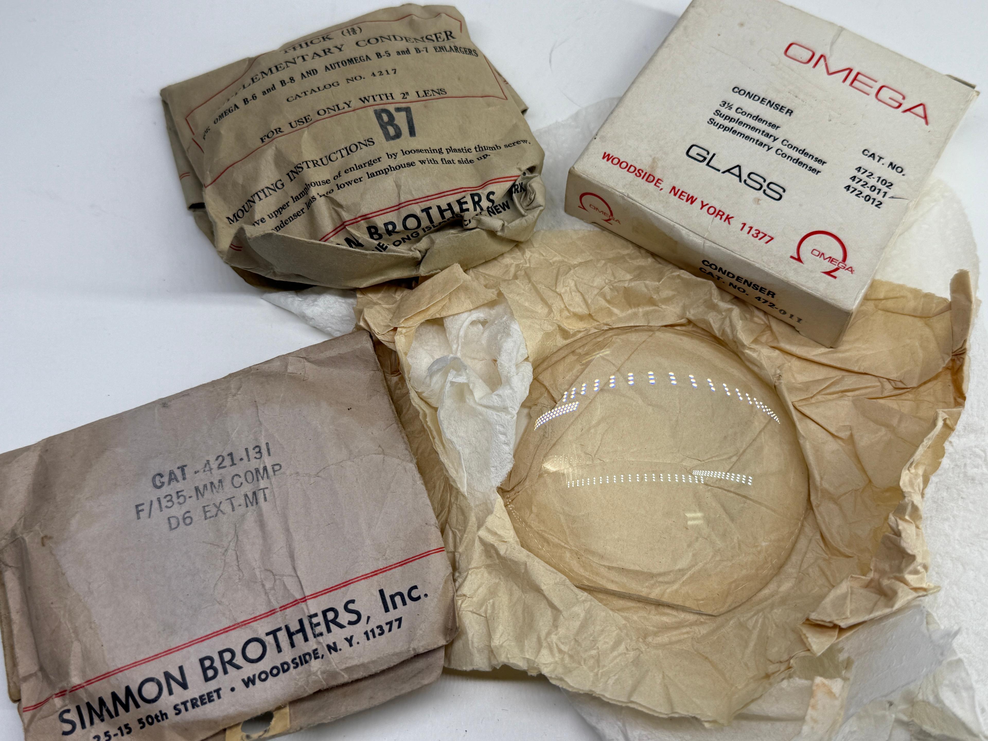 Assortment of Vintage Omega & Simmon Enlarger Condenser Lenses in Original Packaging