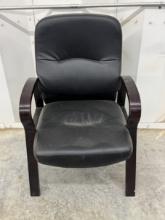 Black Leather Padded Chair with Wooden Armrests and Wooden Legs