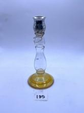 Candle stand with a little bit of liquid Avon bottle