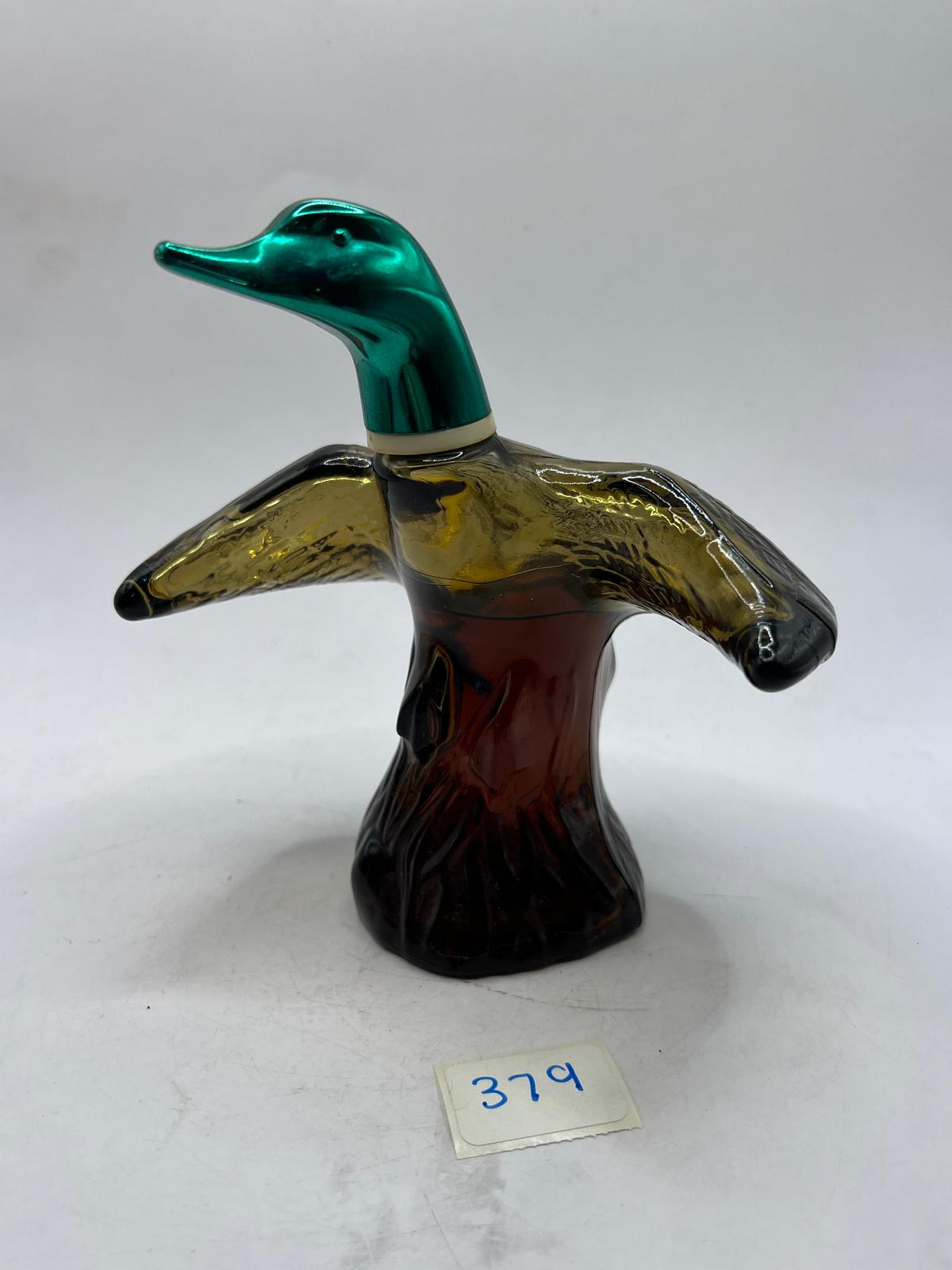Mallard-in-flight with liquid Avon bottle