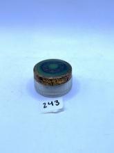 Clear with green lid Avon bottle