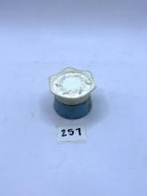 Small blue and white Avon bottle