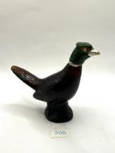 Pheasant decanter with some liquid Avon bottle