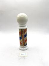 Barber pole with liquid Avon bottle