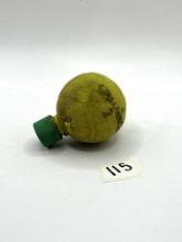 Tennis Ball with some liquid Avon bottle