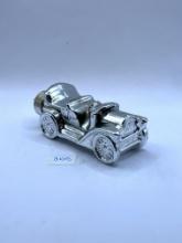 Silver car with some liquid Avon bottle
