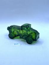 Green truck with some liquid Avon bottle