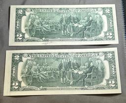 2- 1976 First Day Issue $2.00 Notes, w/ sequential serial numbers