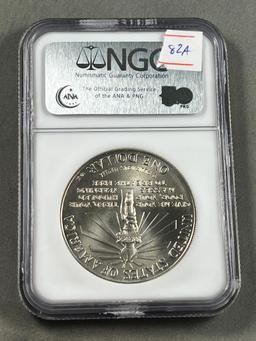 1986P Ellis Island Commemorative Dollar in MS69 NGC Holder