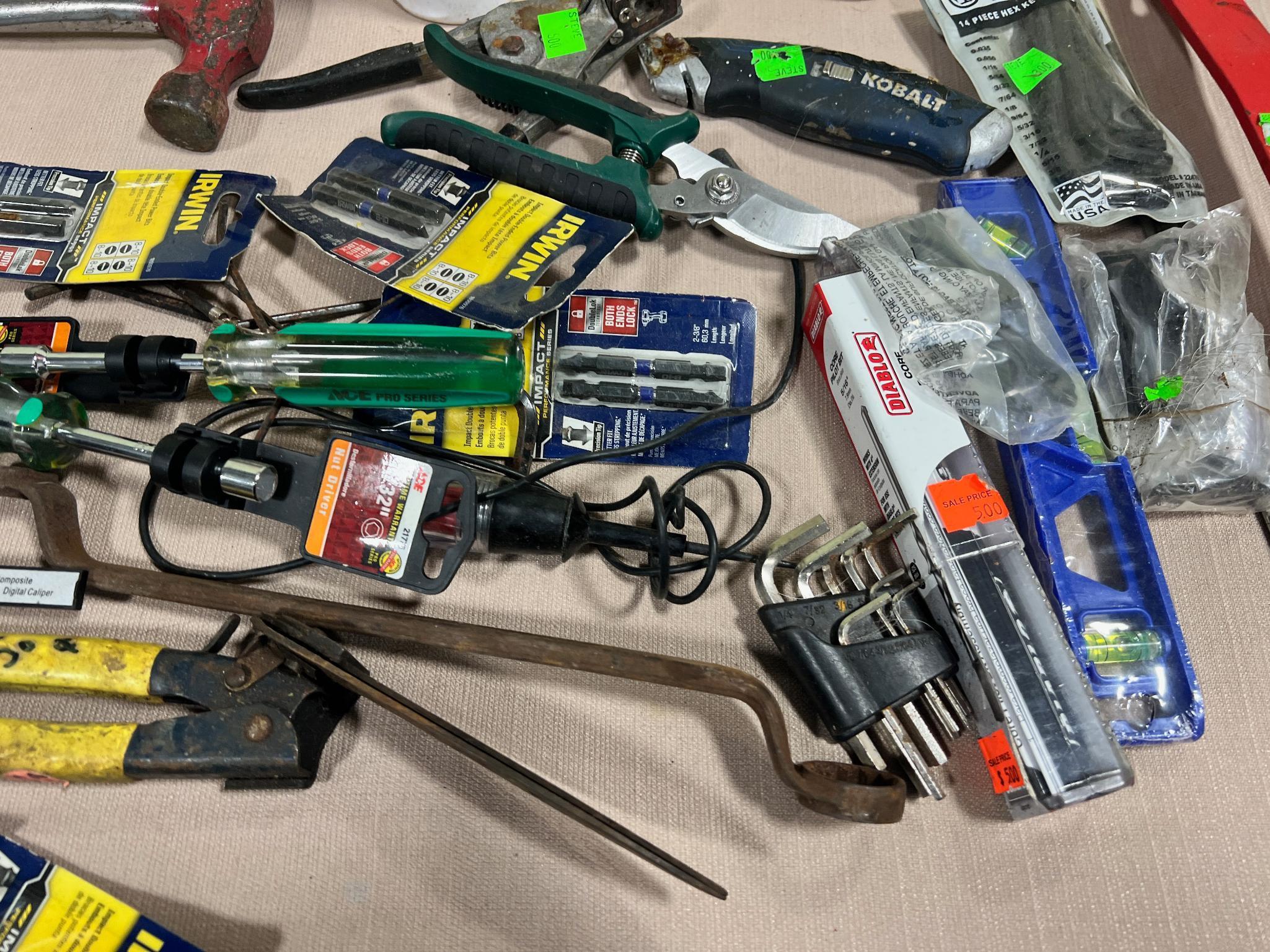 Lot of asst. tools, some unused, Chalk, pry bars, hammers, wrenches and more