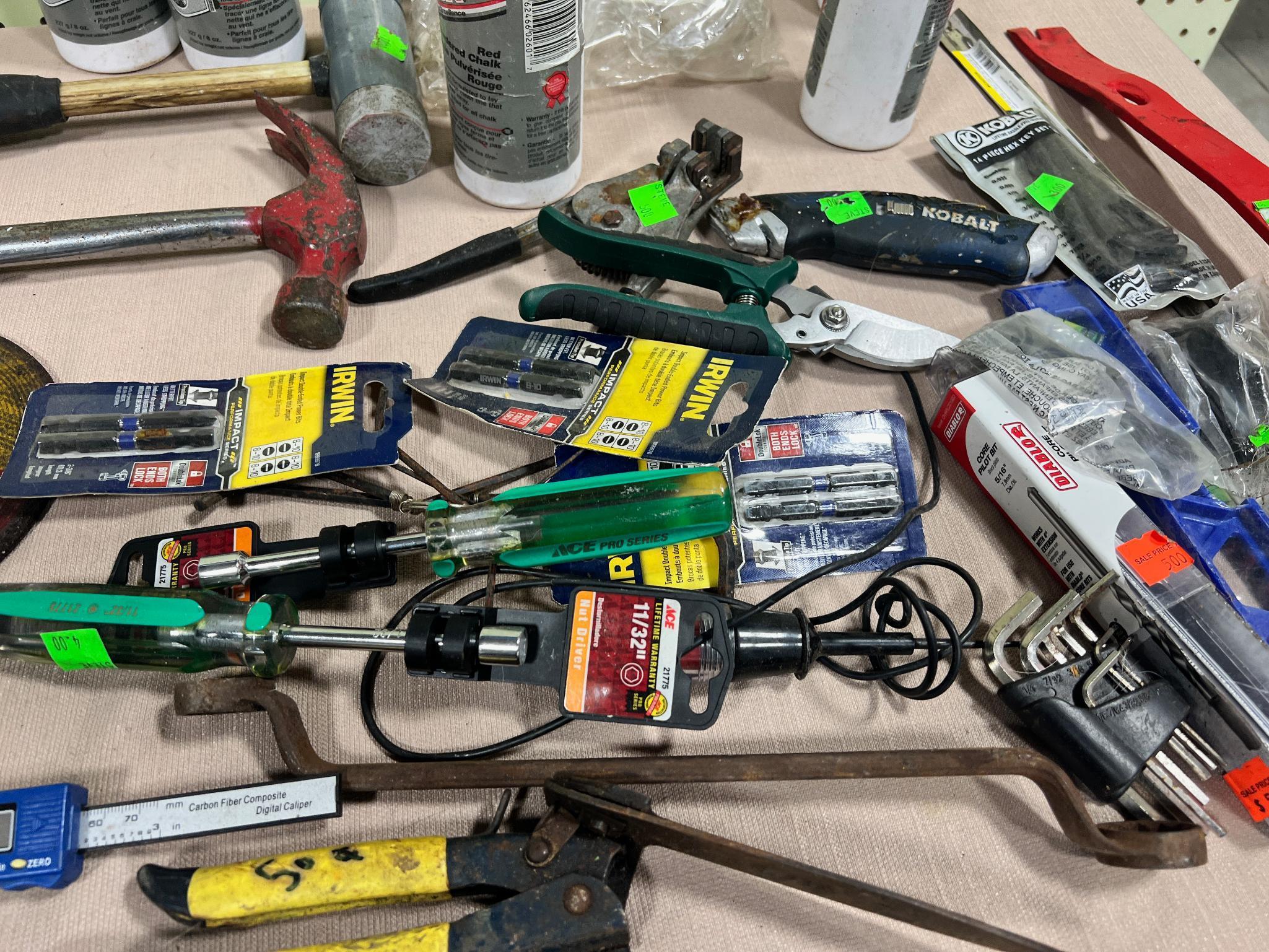 Lot of asst. tools, some unused, Chalk, pry bars, hammers, wrenches and more