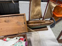 Cedar box full of vintage handkerchiefs and model sail boat