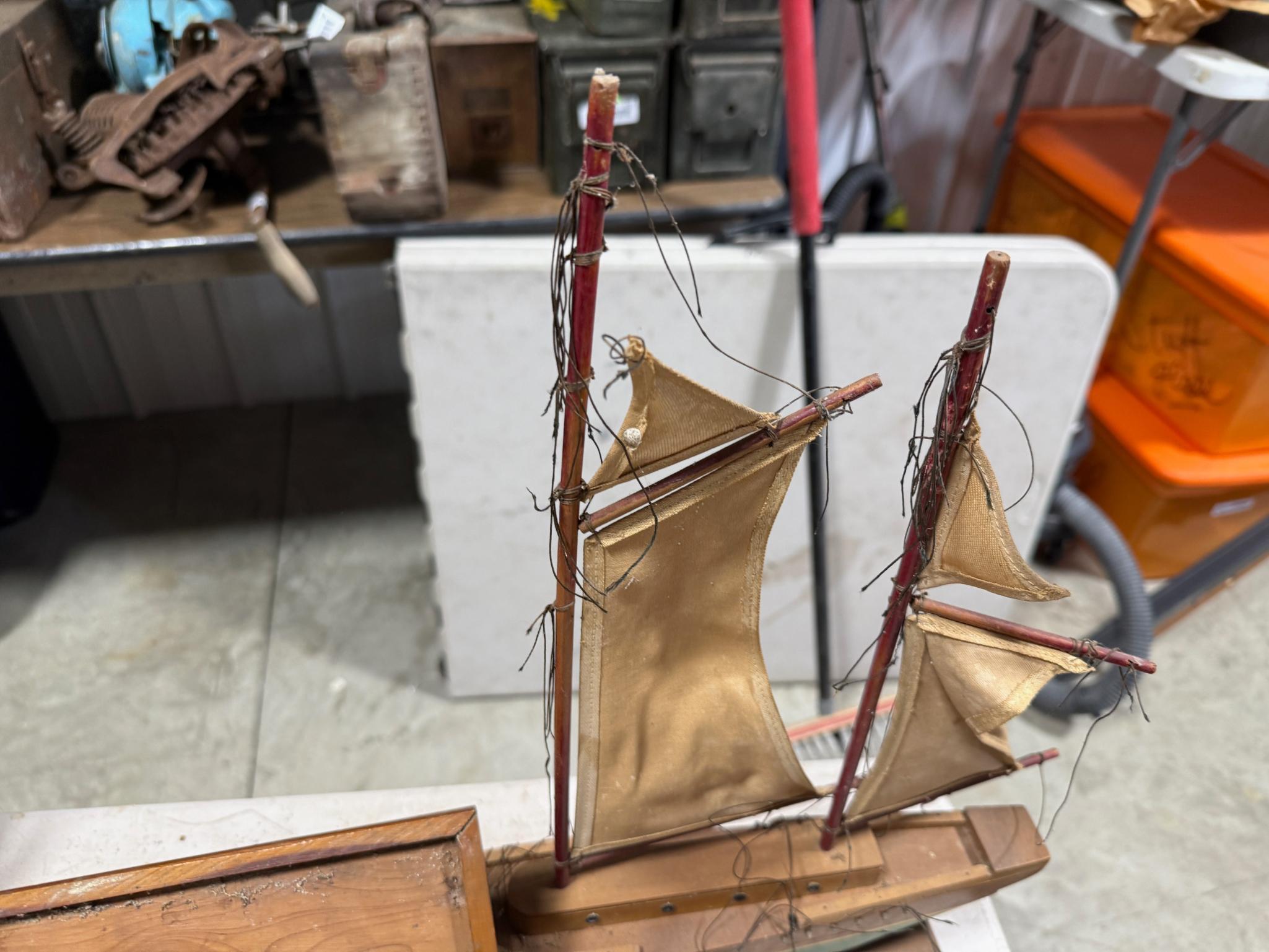 Cedar box full of vintage handkerchiefs and model sail boat