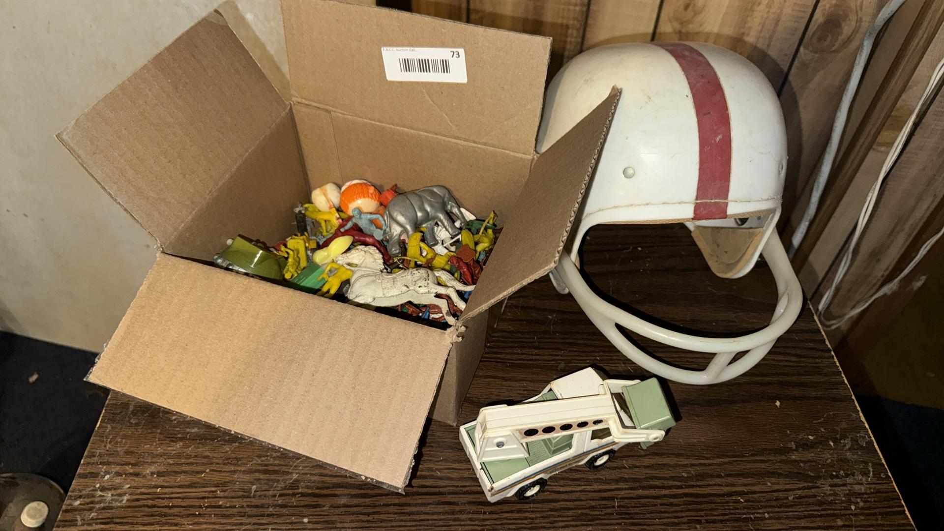 Vintage Football Helmet with Red Stripe and Toy Collection