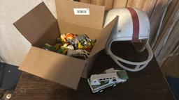Vintage Football Helmet with Red Stripe and Toy Collection