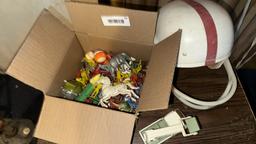 Vintage Football Helmet with Red Stripe and Toy Collection