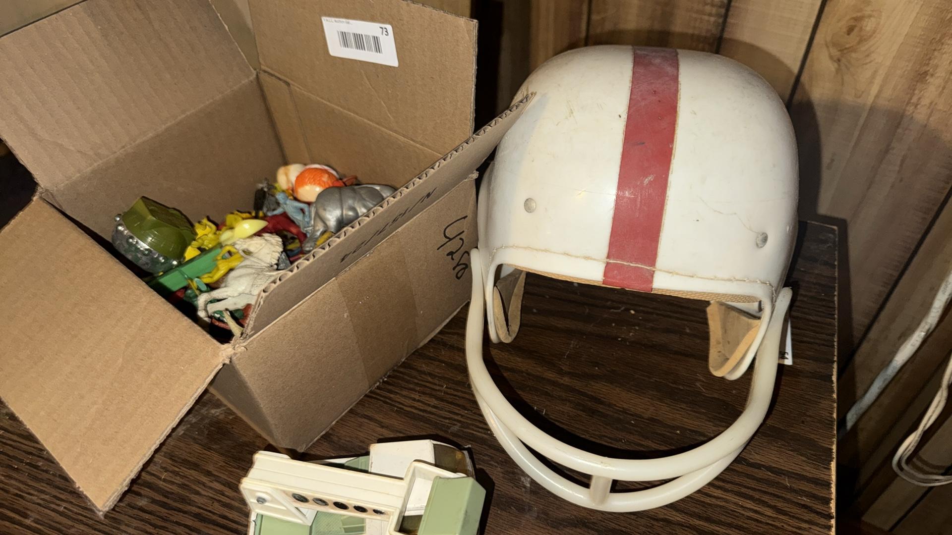 Vintage Football Helmet with Red Stripe and Toy Collection