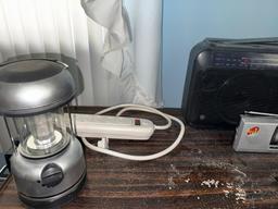 Bedside table w/ contents, light, and radios