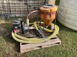 1,500 gal. poly tank w/2in. pump