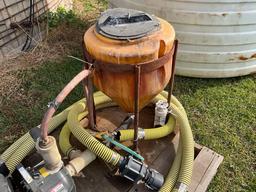 1,500 gal. poly tank w/2in. pump