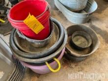 (3) stacks of feed tubs, baskets etc.