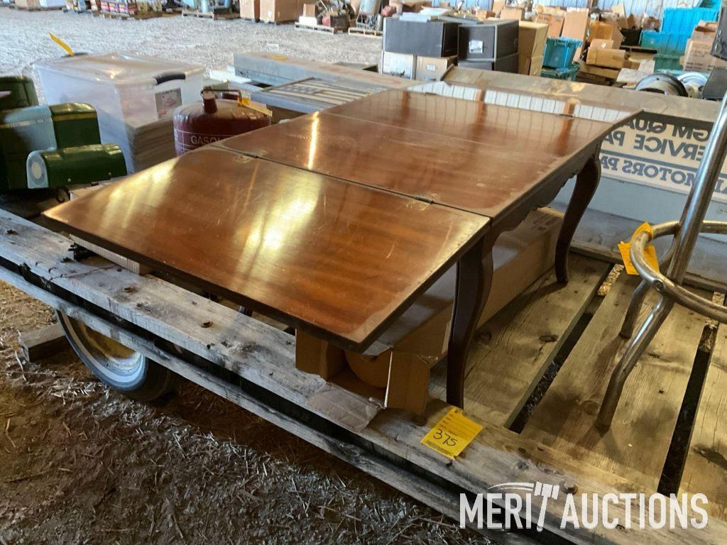 Goodwrench and Chevy bar stools, wooden coffee table, masking tape