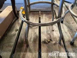 Goodwrench and Chevy bar stools, wooden coffee table, masking tape