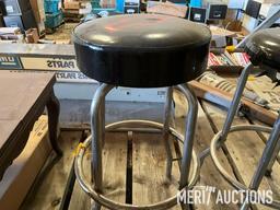 Goodwrench and Chevy bar stools, wooden coffee table, masking tape