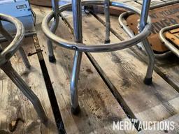 Goodwrench and Chevy bar stools, wooden coffee table, masking tape
