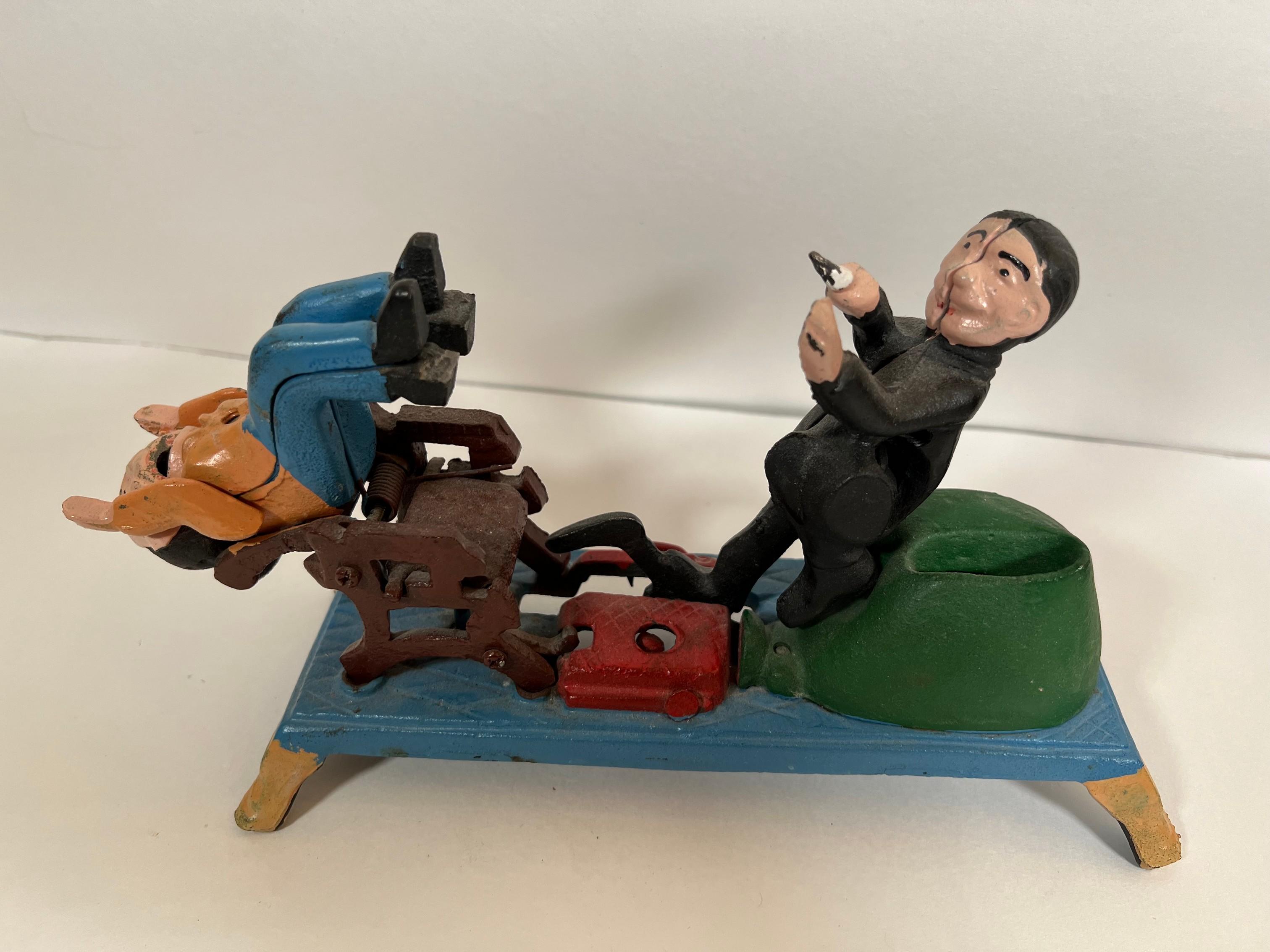 VINTAGE CAST IRON TOY BANK - DENTIST PULLING TEETH