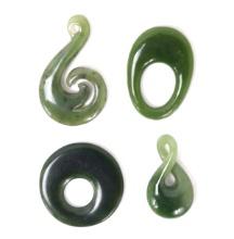 Group of Four Chinese Jade Style Pendants