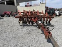 White Cultivator with spike drag attachment