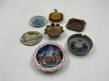 7 - ashtrays - 1 - 4 in tin bridal cave mo. , 1 - 4in brown scott prophestown, 4in coin, 1 - 4in tin