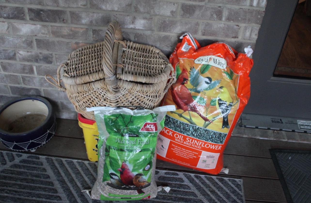 Bird Seed Lot, includes hanging bird cage