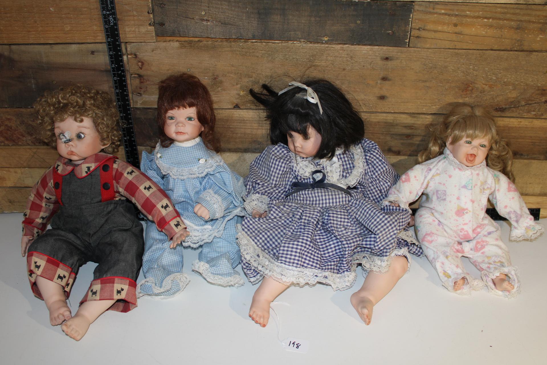 Lot of four Large Porcelain Dolls