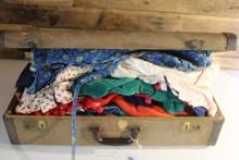 Vintage Suitcase and childrens clothing.