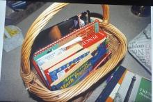 Basket containing magazines, books, bibles and more.