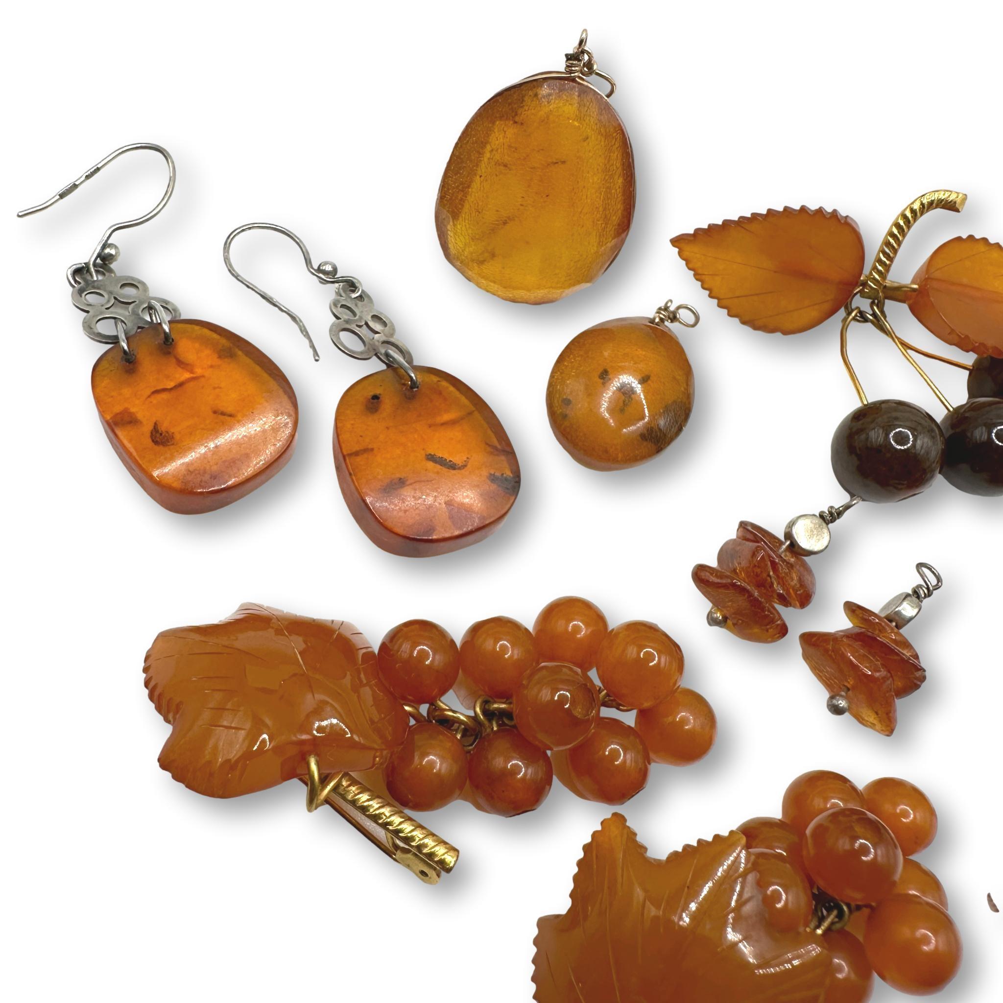 Large Collection of Vintage Amber Earrings, Pins, and Cufflinks