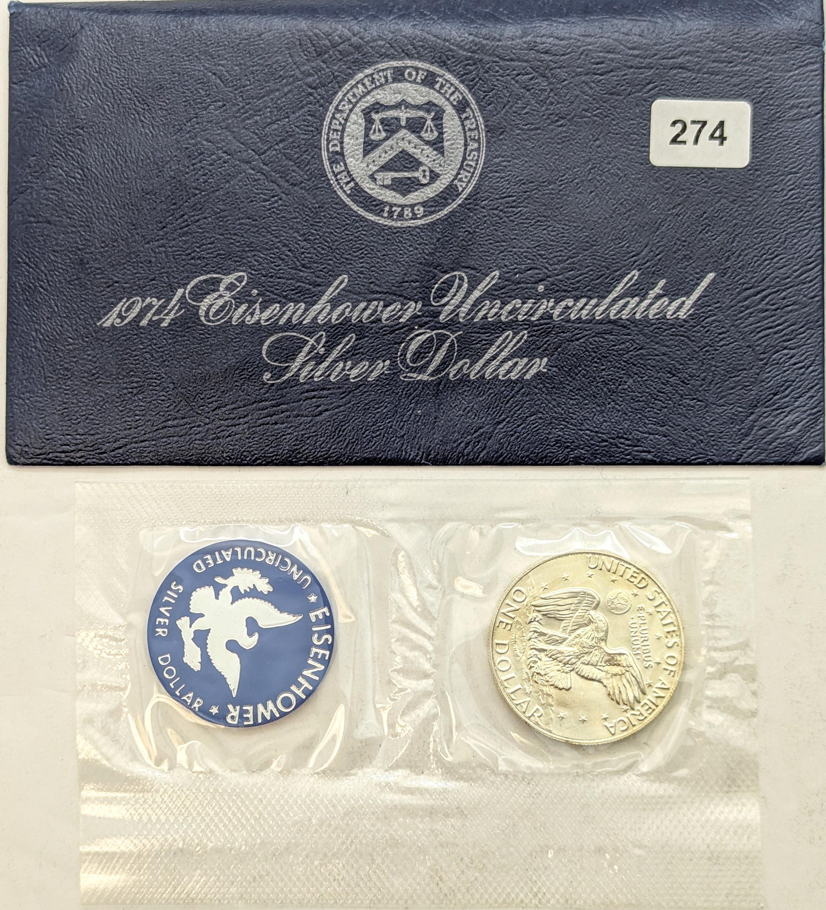 1974 Silver Blue Ike Dollar with Official Blue Envelope and Token From the Department of Treasury
