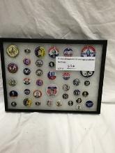 Glass showcase of vintage politcal buttons