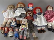 Collection of Raggedy Ann and Andy Dolls in Various Sizes and Styles