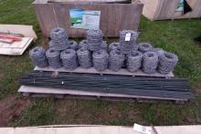 NEW - In crate 20 rolls of barbed wire and 41 T post kit.