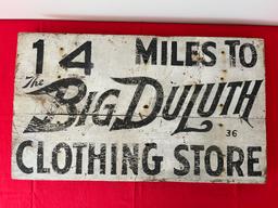 Big Duluth Clothes Wood Road Sign