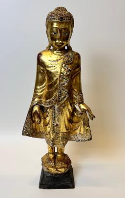 Standing Gold Buddha with colored stones