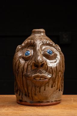 Brown Glazeware Face Jug with Blue Eyes by Mike Craven