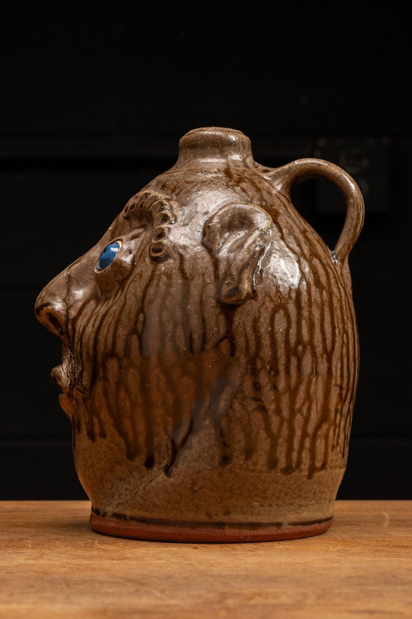 Brown Glazeware Face Jug with Blue Eyes by Mike Craven